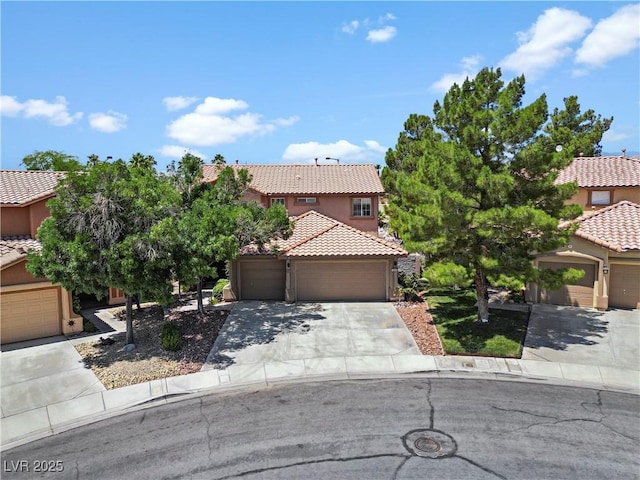 10645 Redwood Grove Ave, Las Vegas, NV 89144 - view of front of property featuring a tiled roof, stucco siding, a garage, and driveway