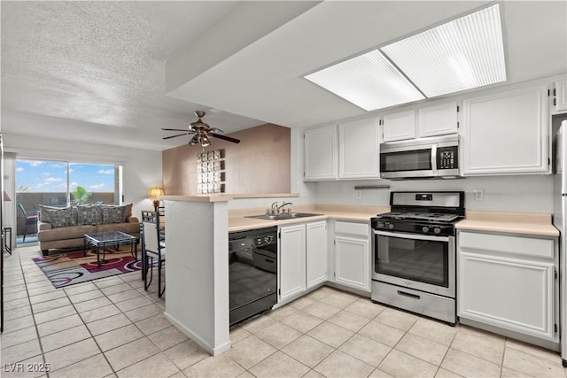 8070 W Russell Rd Unit 1023, Las Vegas, NV 89113 - kitchen featuring stainless steel appliances, light tile patterned floors, ceiling fan, light countertops, and a textured ceiling