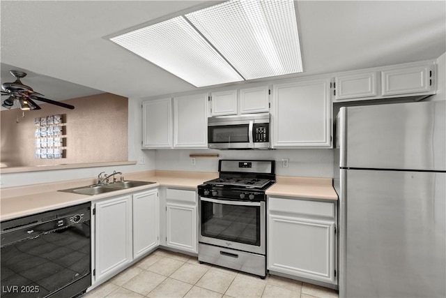 8070 W Russell Rd Unit 1023, Las Vegas, NV 89113 - kitchen featuring appliances with stainless steel finishes, light tile patterned floors, a ceiling fan, light countertops, and white cabinets