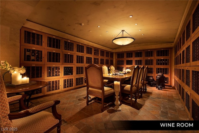 1 Hughes Center Dr Unit 903, Las Vegas, NV 89169 - wine room featuring lofted ceiling, stone tile flooring, and recessed lighting