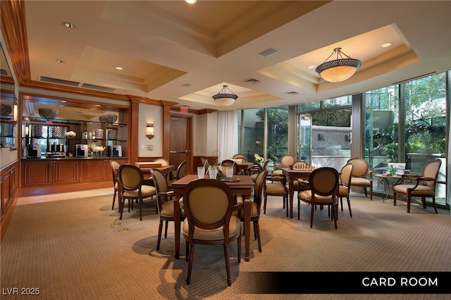 1 Hughes Center Dr Unit 903, Las Vegas, NV 89169 - dining room featuring light carpet, a raised ceiling, recessed lighting, wainscoting, and a community bar
