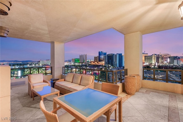 1 Hughes Center Dr Unit 903, Las Vegas, NV 89169 - balcony at dusk with a view of city and outdoor lounge area