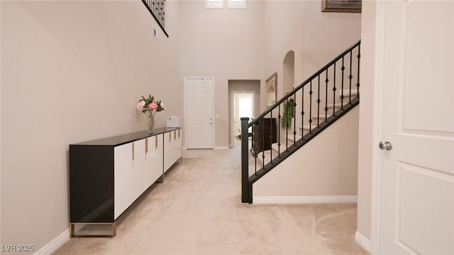 2913 Monate Ct, Henderson, NV 89044 - foyer entrance with stairs, light colored carpet, and a high ceiling