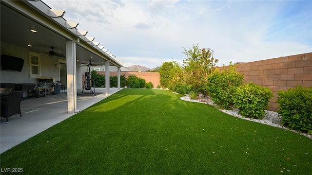 2913 Monate Ct, Henderson, NV 89044 - fenced backyard featuring a ceiling fan and a patio area