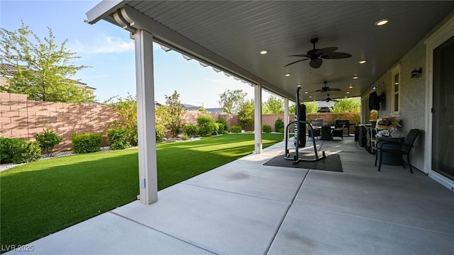 2913 Monate Ct, Henderson, NV 89044 - fenced backyard with a ceiling fan and a patio area