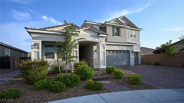 2913 Monate Ct, Henderson, NV 89044 - view of front facade with decorative driveway, a garage, and stucco siding