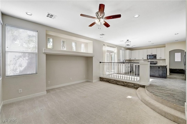 9021 Rendon St, Las Vegas, NV 89143 - unfurnished living room with ceiling fan, plenty of natural light, and recessed lighting