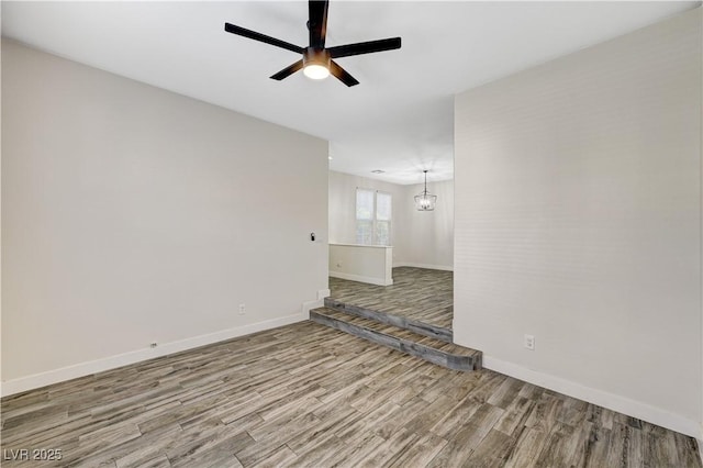 9021 Rendon St, Las Vegas, NV 89143 - unfurnished room with wood finished floors, ceiling fan, and a chandelier