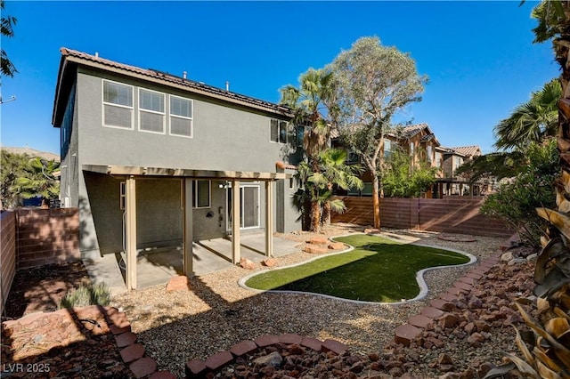 9021 Rendon St, Las Vegas, NV 89143 - rear view of house with a patio area, a fenced backyard, and stucco siding