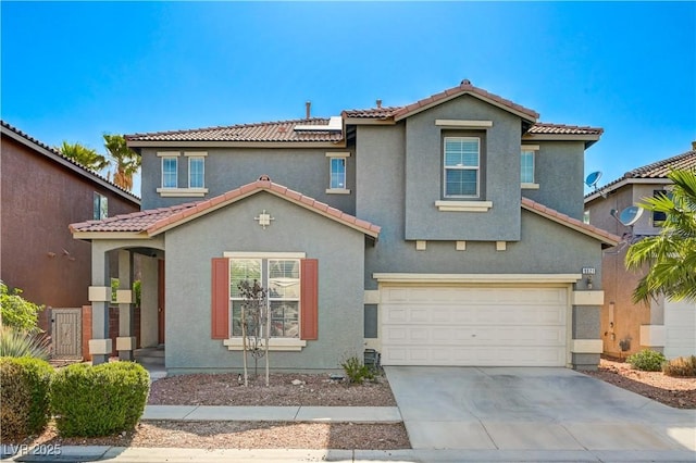 9021 Rendon St, Las Vegas, NV 89143 - mediterranean / spanish house with a tile roof, a garage, concrete driveway, and stucco siding