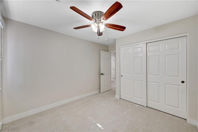 9021 Rendon St, Las Vegas, NV 89143 - unfurnished bedroom featuring light carpet, a closet, and ceiling fan