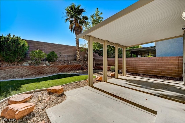 9021 Rendon St, Las Vegas, NV 89143 - fenced backyard with a patio area