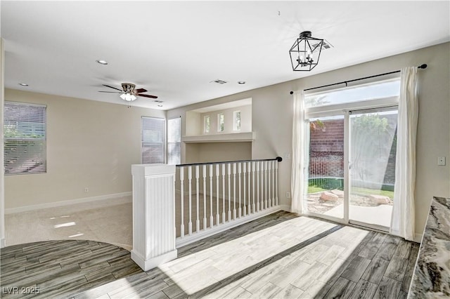 9021 Rendon St, Las Vegas, NV 89143 - corridor with wood finished floors, healthy amount of natural light, and a chandelier
