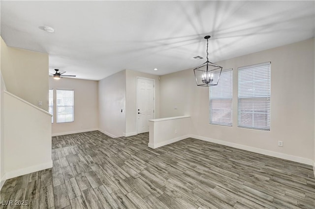 9021 Rendon St, Las Vegas, NV 89143 - empty room with wood finished floors, ceiling fan, and a chandelier