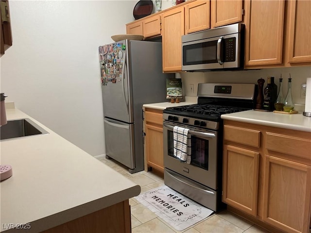 700 Carnegie St Unit 4821, Henderson, NV 89052 - kitchen featuring stainless steel appliances, light countertops, and light tile patterned floors