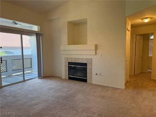 700 Carnegie St Unit 4821, Henderson, NV 89052 - unfurnished living room with carpet, a tile fireplace, and a ceiling fan