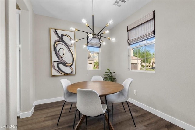 8353 Lower Trailhead Ave, Las Vegas, NV 89113 - dining area with a chandelier and dark wood finished floors
