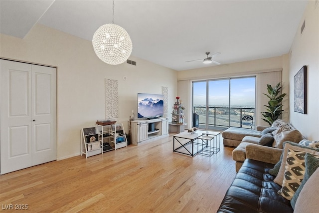 8255 Las Vegas Blvd Unit 1905, Las Vegas, NV 89123 - living room with a chandelier, wood finished floors, and a ceiling fan