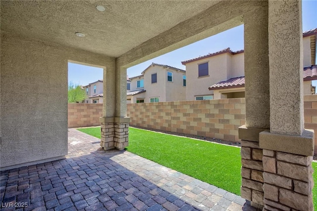 835 Aurelie Ridge St, Henderson, NV 89011 - fenced backyard featuring a patio and a residential view