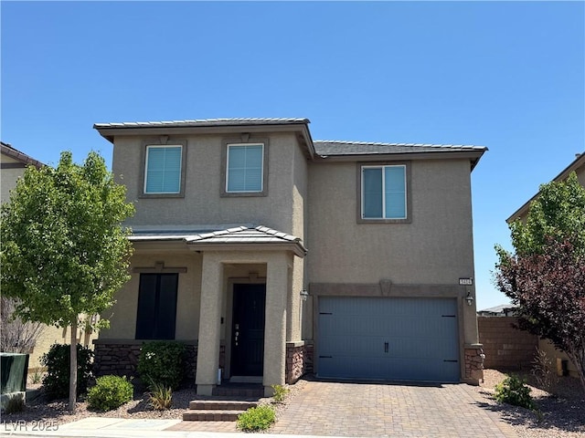5414 Enchanted Rose St, Las Vegas, NV 89148 - traditional home with stucco siding, a garage, decorative driveway, and stone siding