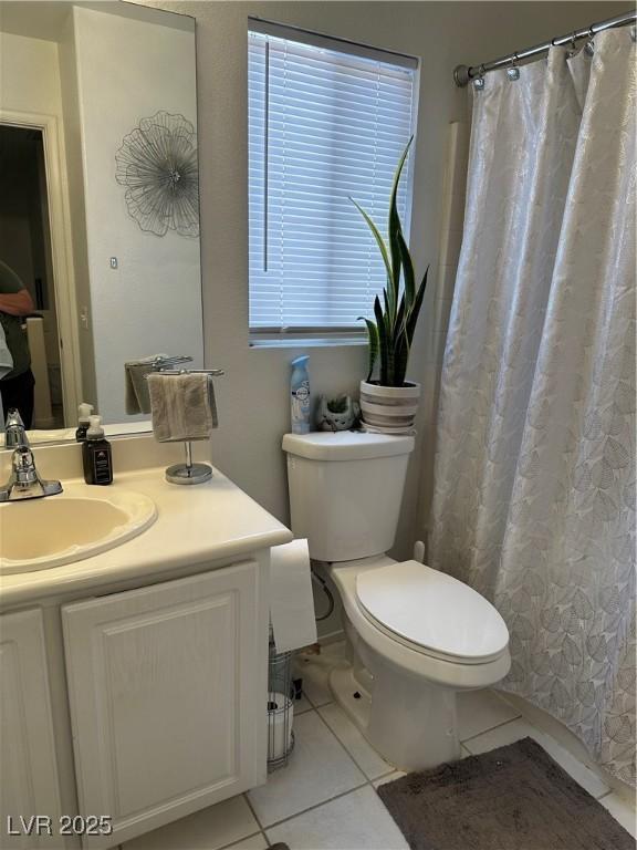 10265 Moth Orchid Ct, Las Vegas, NV 89183 - full bathroom with tile patterned floors, vanity, and a shower with curtain