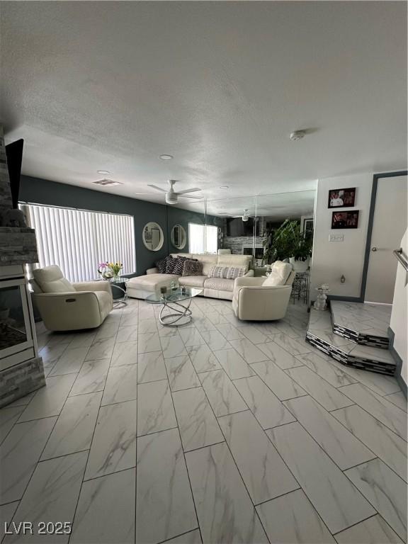 10265 Moth Orchid Ct, Las Vegas, NV 89183 - living area featuring marble finish flooring