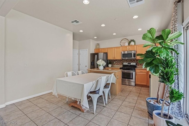 953 Via Del Tramonto St, Henderson, NV 89011 - kitchen featuring stainless steel appliances, light tile patterned floors, light countertops, tasteful backsplash, and recessed lighting