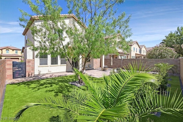 953 Via Del Tramonto St, Henderson, NV 89011 - back of property with stucco siding and a patio