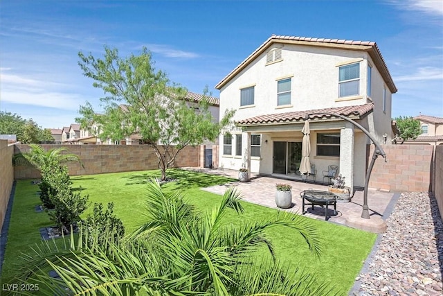 953 Via Del Tramonto St, Henderson, NV 89011 - rear view of property featuring stucco siding, a fenced backyard, a patio, and a tile roof