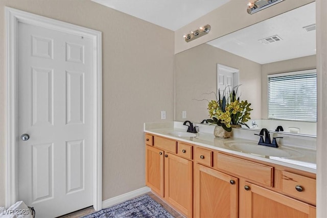 953 Via Del Tramonto St, Henderson, NV 89011 - bathroom featuring double vanity and baseboards