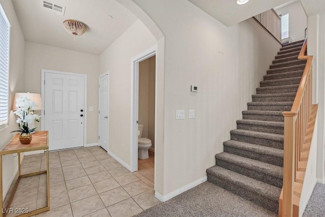 953 Via Del Tramonto St, Henderson, NV 89011 - foyer with arched walkways, stairs, and light tile patterned flooring