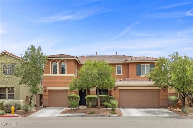 10300 S Dapple Gray Rd, Las Vegas, NV 89178 - view of front facade featuring an attached garage, concrete driveway, and stucco siding