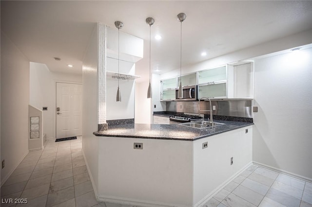 10414 Midseason Mist St, Las Vegas, NV 89183 - kitchen featuring open shelves, stainless steel microwave, a peninsula, stove, and recessed lighting