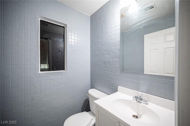 10414 Midseason Mist St, Las Vegas, NV 89183 - bathroom featuring tile walls and vanity