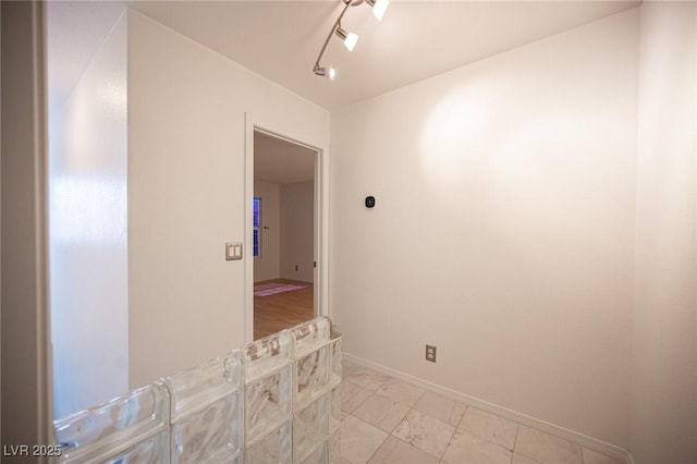10414 Midseason Mist St, Las Vegas, NV 89183 - spare room featuring baseboards and light marble finish floors