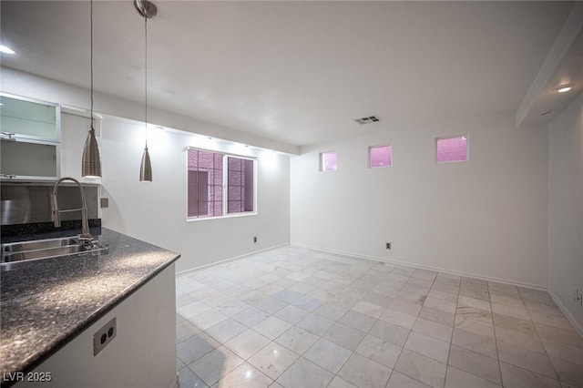 10414 Midseason Mist St, Las Vegas, NV 89183 - empty room featuring a sink and baseboards