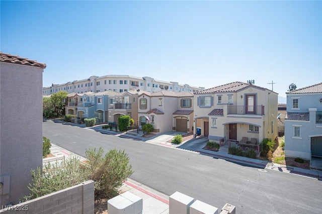 10414 Midseason Mist St, Las Vegas, NV 89183 - view of asphalt road with sidewalks, a residential view, and curbs
