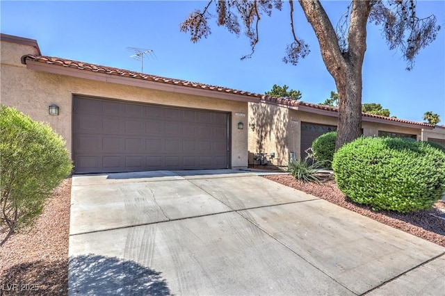 1857 Arbol Verde Way, Las Vegas, NV 89119 - view of front facade with a garage, stucco siding, and driveway
