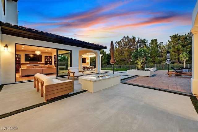 11906 Port Labelle Dr, Las Vegas, NV 89141 - patio terrace at dusk with a patio area and an outdoor living space with a fire pit