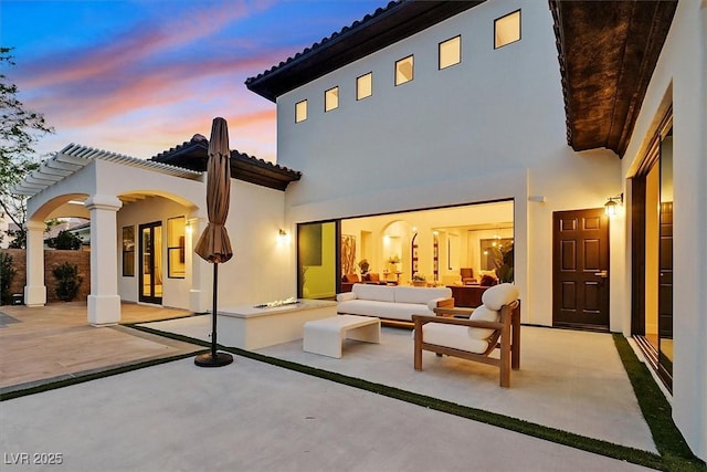 11906 Port Labelle Dr, Las Vegas, NV 89141 - back of property featuring a patio area, a tile roof, stucco siding, and an outdoor hangout area
