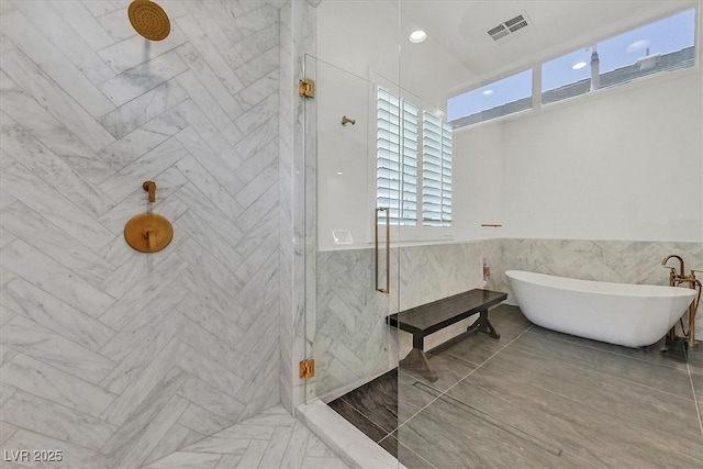11906 Port Labelle Dr, Las Vegas, NV 89141 - full bathroom with a marble finish shower, a soaking tub, tile walls, and wainscoting