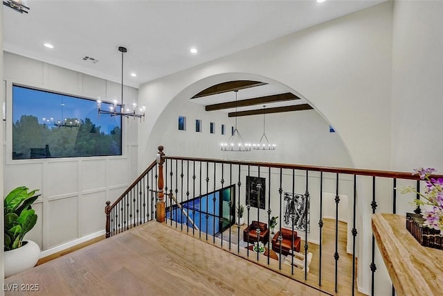 11906 Port Labelle Dr, Las Vegas, NV 89141 - corridor with a chandelier, an upstairs landing, wood finished floors, recessed lighting, and beam ceiling
