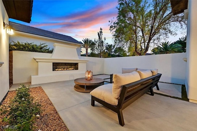 11906 Port Labelle Dr, Las Vegas, NV 89141 - view of patio with a lit fireplace