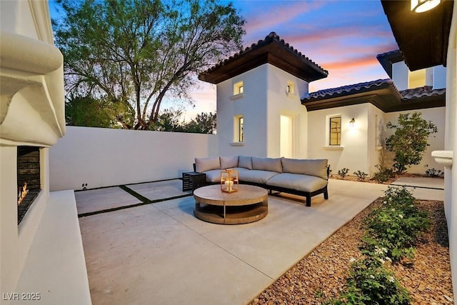 11906 Port Labelle Dr, Las Vegas, NV 89141 - patio terrace at dusk featuring a patio and outdoor lounge area