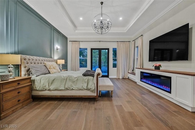 11906 Port Labelle Dr, Las Vegas, NV 89141 - bedroom with a tray ceiling, french doors, a chandelier, wood finished floors, and access to exterior