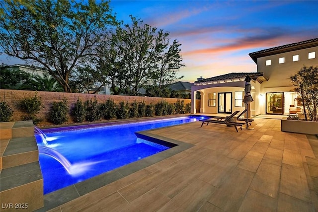 11906 Port Labelle Dr, Las Vegas, NV 89141 - pool at dusk with a patio area and a fenced backyard