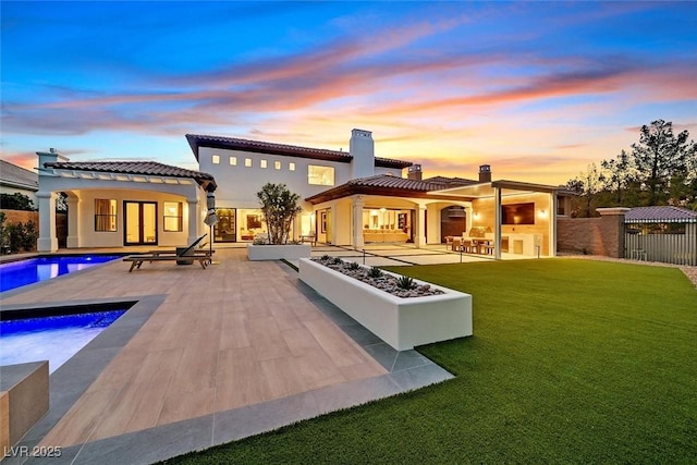 11906 Port Labelle Dr, Las Vegas, NV 89141 - back of house with a patio, a chimney, a tile roof, and a hot tub