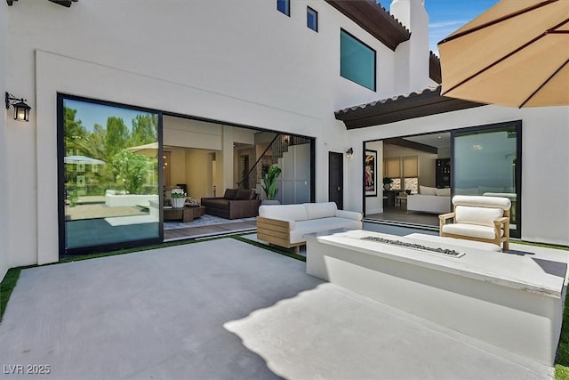 11906 Port Labelle Dr, Las Vegas, NV 89141 - view of patio with an outdoor living space with a fire pit