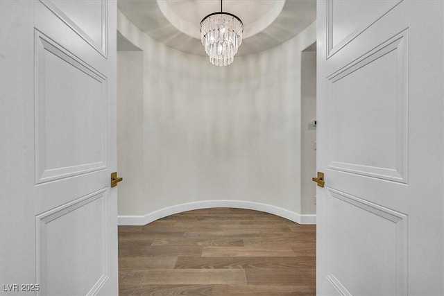 11906 Port Labelle Dr, Las Vegas, NV 89141 - walk in closet featuring wood finished floors and a chandelier
