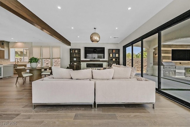 11906 Port Labelle Dr, Las Vegas, NV 89141 - living room with recessed lighting, wood finished floors, and beam ceiling